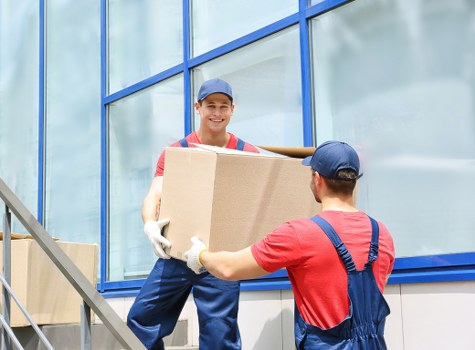 Moving van and boxes for a home move in Southkensington street setting