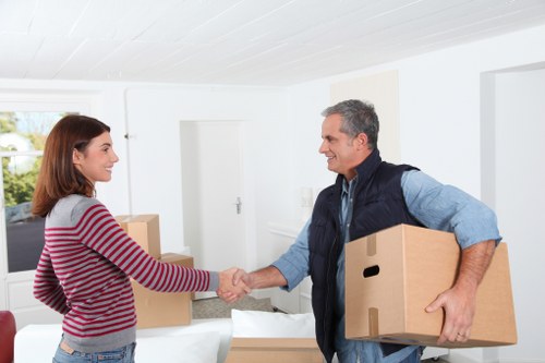 Professional packers preparing household items carefully in Southkensington