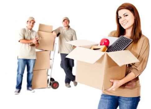 Mover wearing PPE while carrying furniture