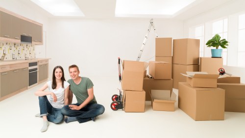 Packed moving boxes and furniture ready for transport