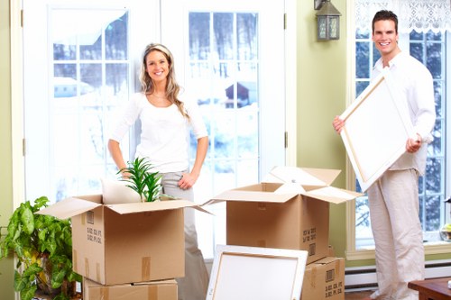 Professional movers handling furniture in Southkensington