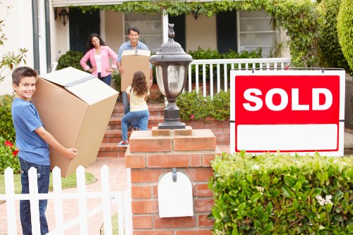 Professional movers loading household items carefully