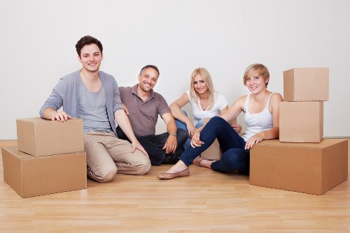 Furniture and boxes being transported by a local removal van